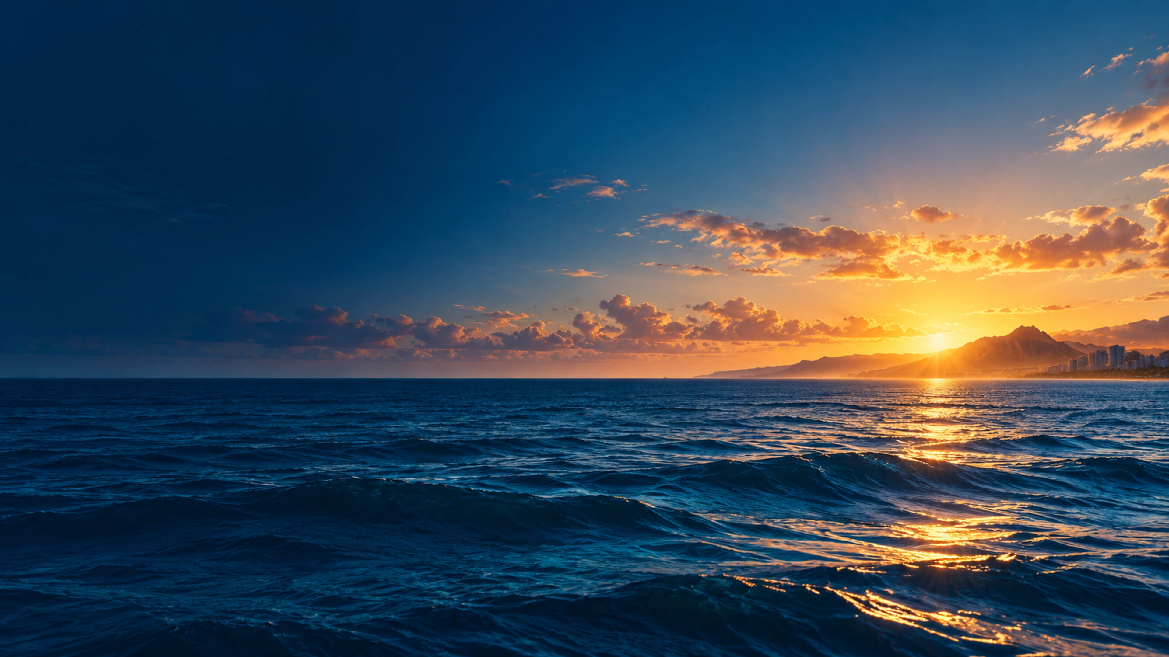 Golden dawn over the ocean and the coastline of Oʻahu